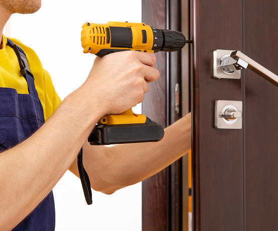 man-repairing-doorknob-handyman-repair-door-lock-room 1 (1).png